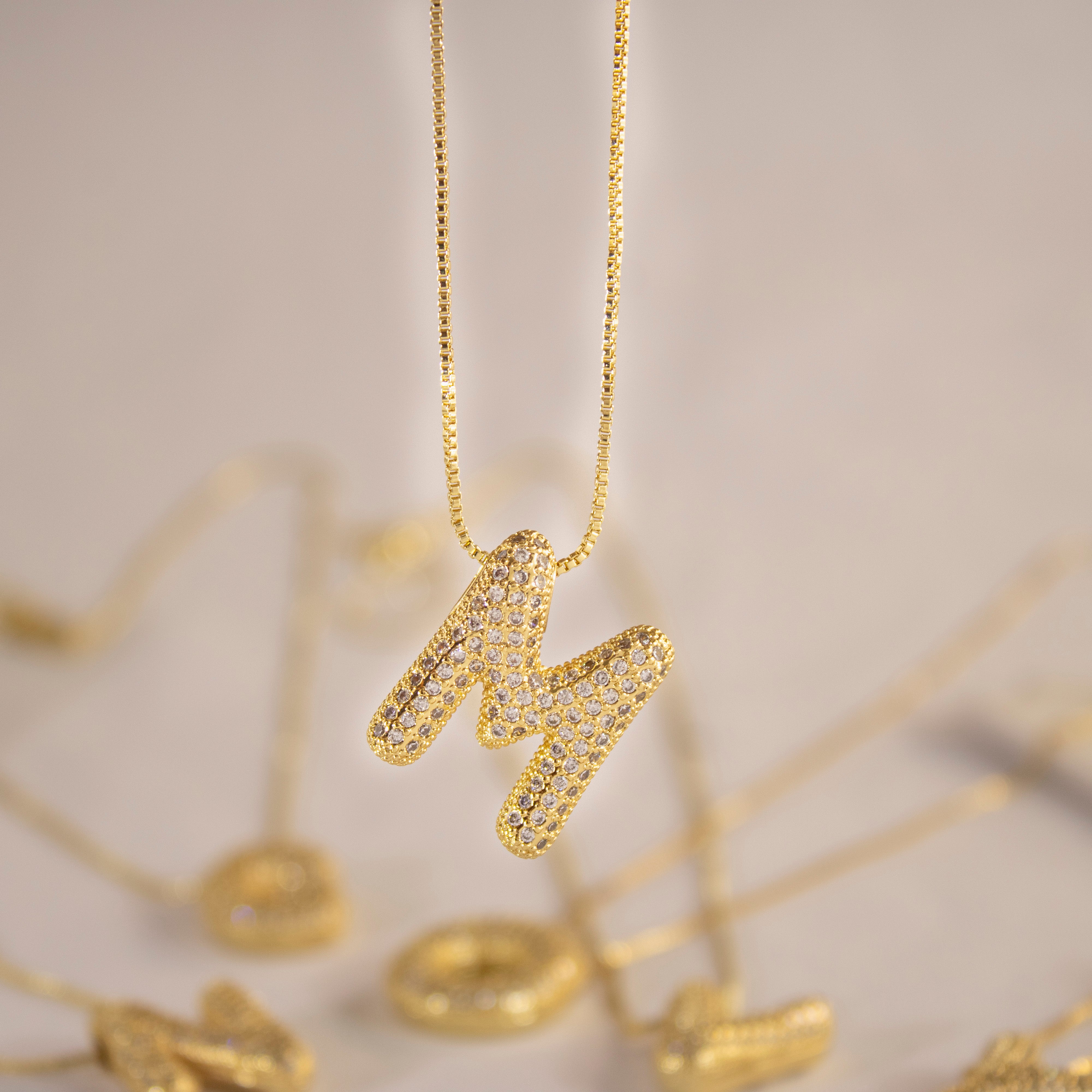 Collection of Inicial con Zirconia tipo globo y cadena con chapa de oro in a gallery layout