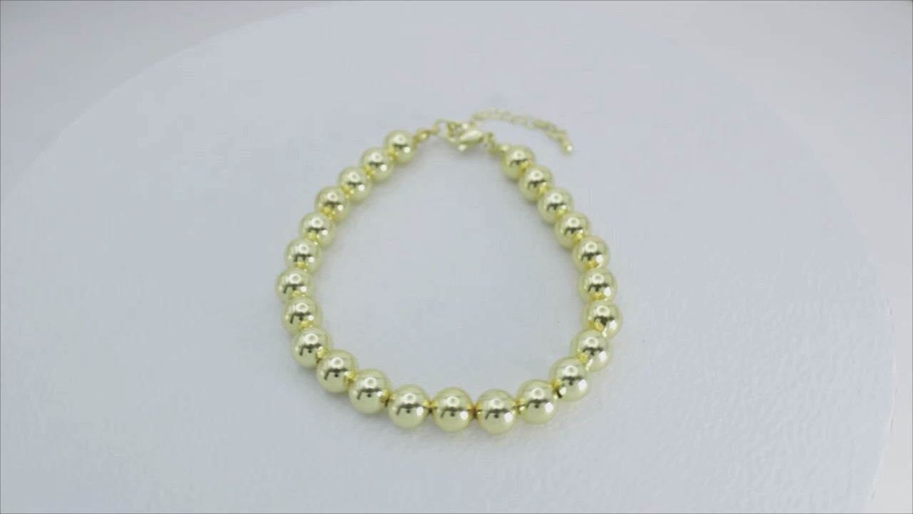 Collection of Pulsera de Bolitas Doradas in a gallery layout